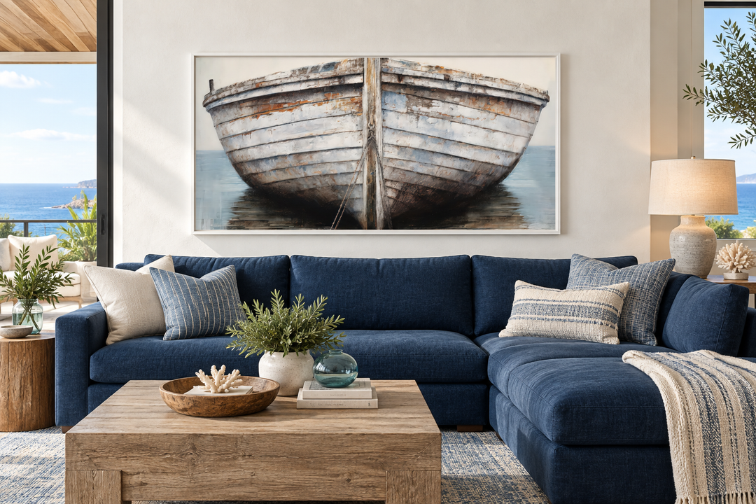 White and brown rustic old boat close-up framed canvas wall art above a blue sectional sofa.