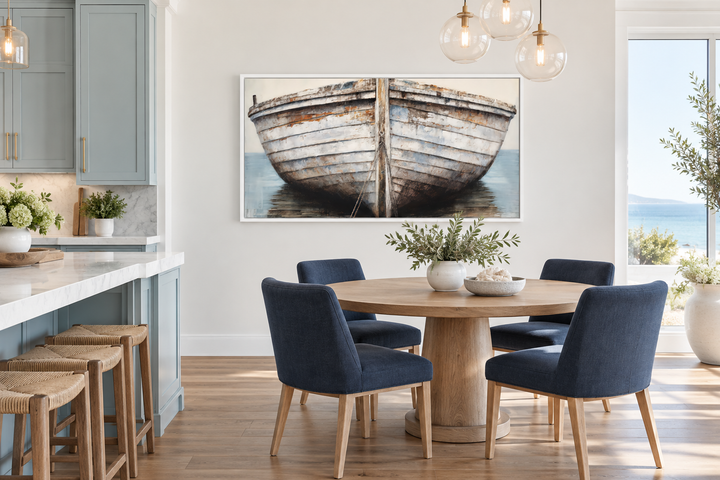 Rustic old boat close-up framed canvas wall art in a coastal dining room with blue chairs.