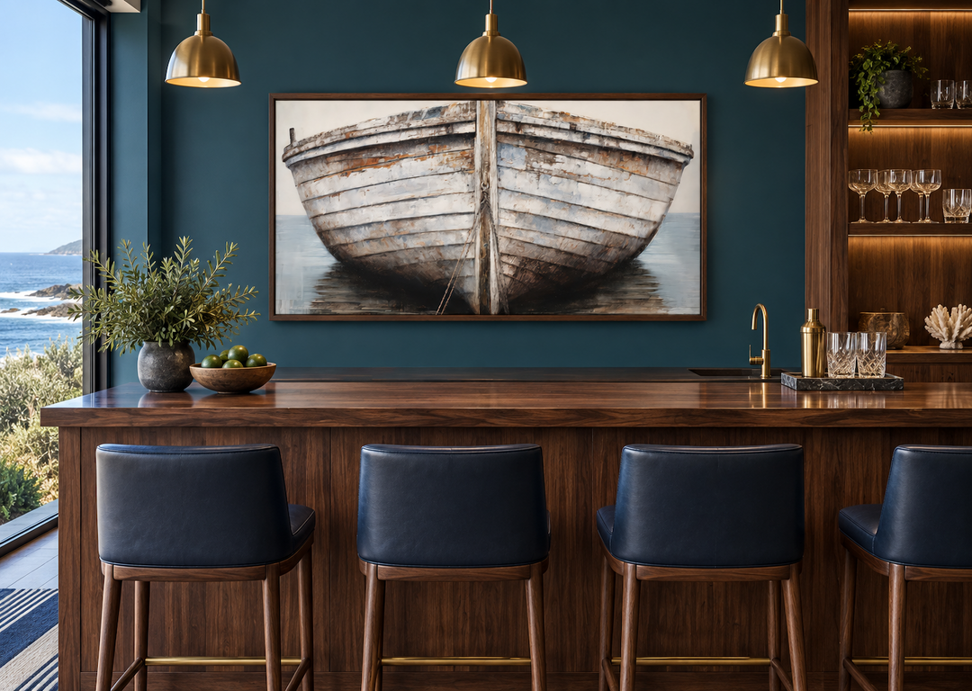 Framed canvas wall art of a rustic white and brown old boat in a modern coastal bar setting.