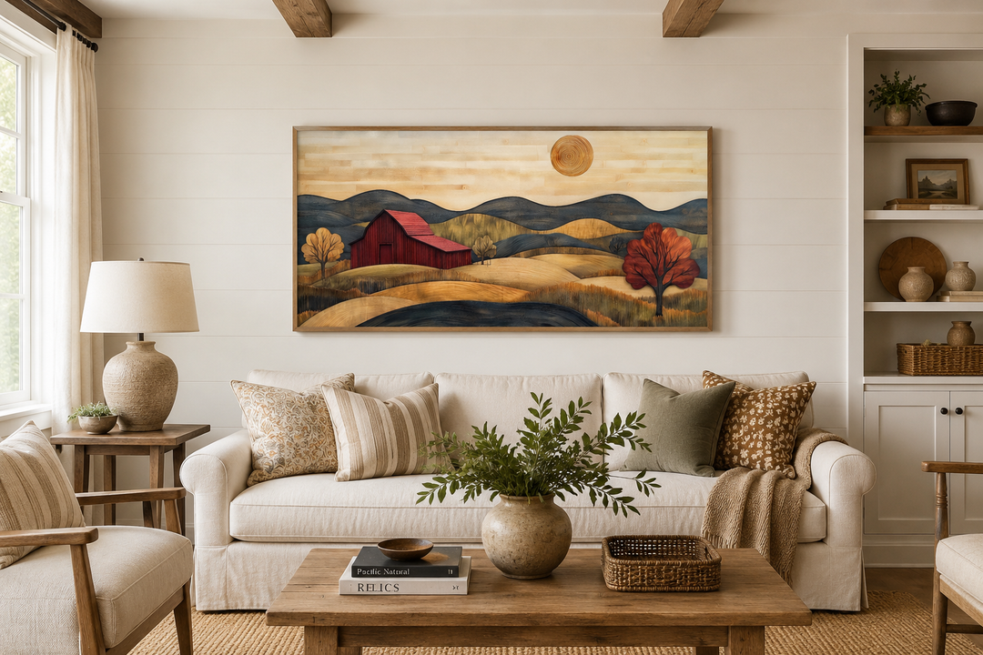 Rustic red barn and farm landscape wood style canvas wall art hanging above a white sofa.