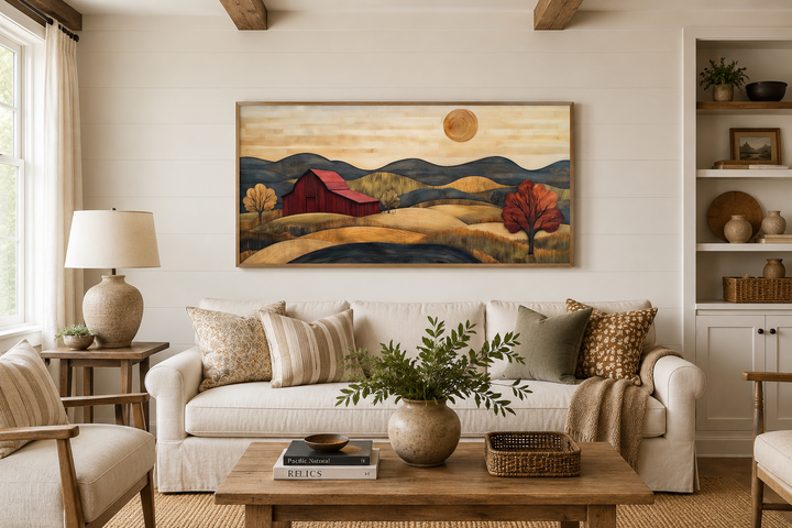 Rustic red barn and farm landscape wood style canvas wall art hanging above a white sofa.
