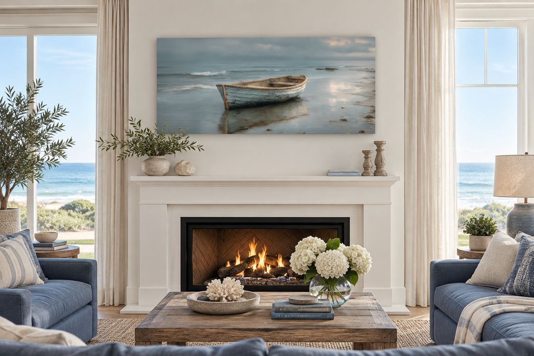 Rustic rowboat on beach coastal framed canvas wall art hanging above a white fireplace mantel.