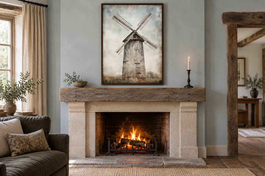 Rustic old windmill painting in a dark wood frame hanging above a stone fireplace mantel.