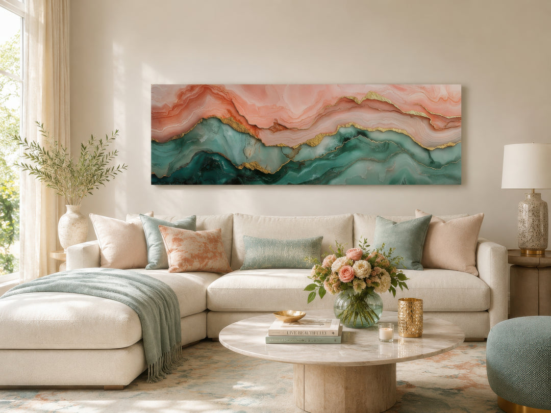 Sage green and blush pink abstract marble horizontal canvas wall art above a white sectional sofa.