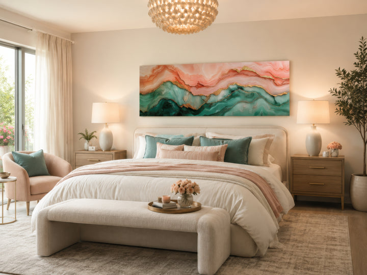 Sage green and blush pink abstract marble horizontal canvas wall art hanging above a bed.
