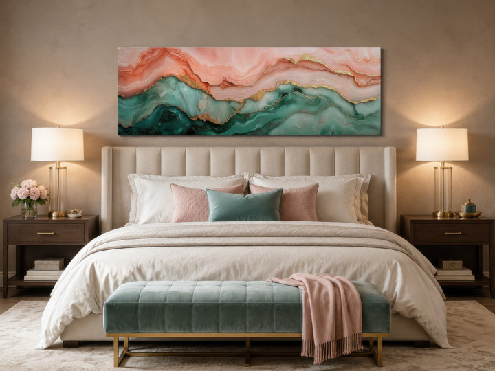 Sage green and blush pink abstract marble canvas wall art hanging above a bed in a bedroom.