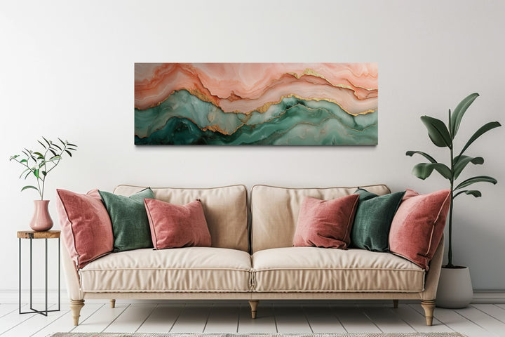 Sage green and blush pink abstract marble horizontal canvas wall art above a beige sofa.
