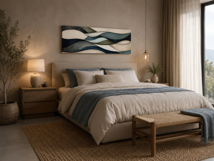 Sage green and brown modern abstract horizontal framed wall art hanging above a bed.