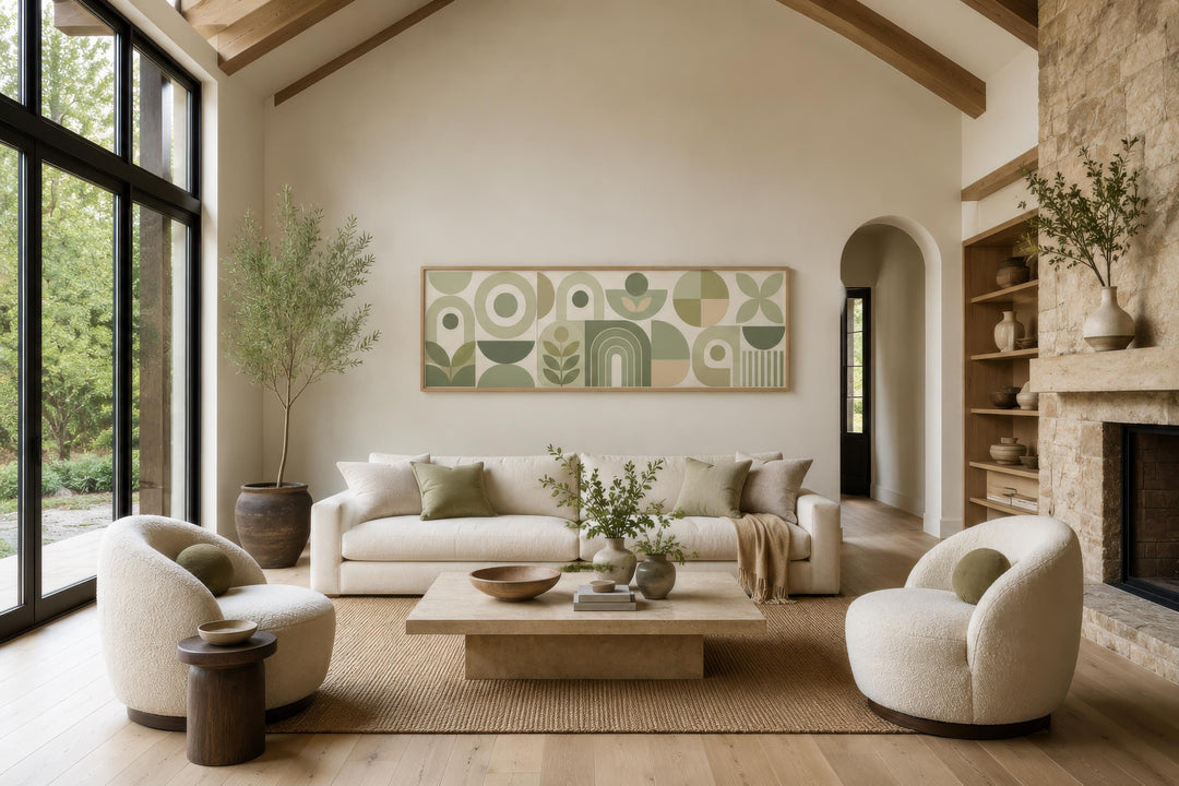 Sage green and cream long narrow geometric canvas wall art hanging above a sofa in a living room.