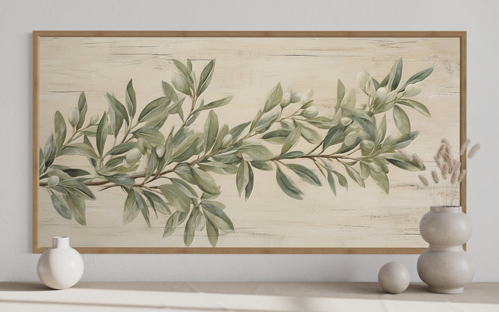 Sage green olive branch painting on wood-textured framed canvas wall art for farmhouse decor.