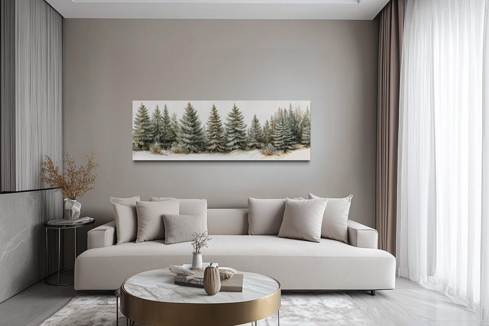 Sage green pine trees wall art on a long horizontal canvas above a neutral sofa in a modern room.