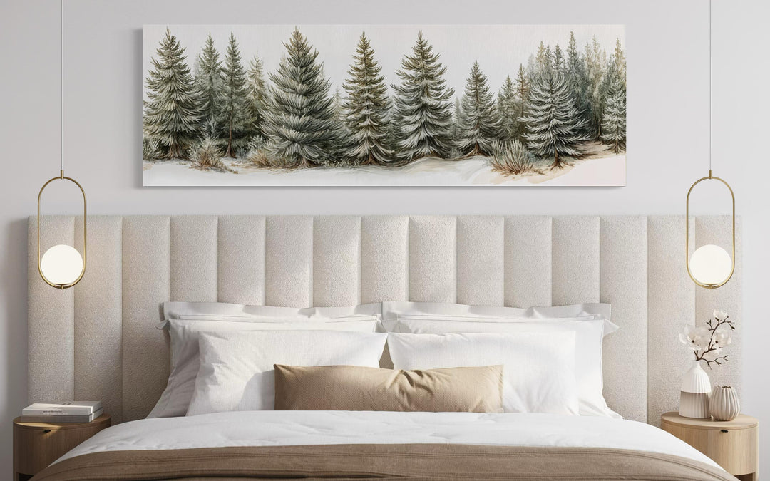 Sage green pine trees wall art on a long horizontal canvas above a modern neutral bed.