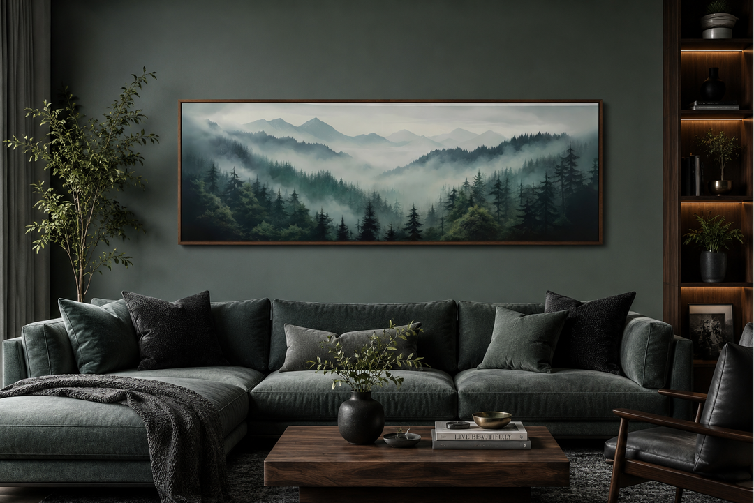 Sage green foggy pine forest and mountain landscape framed canvas wall art above a sofa.