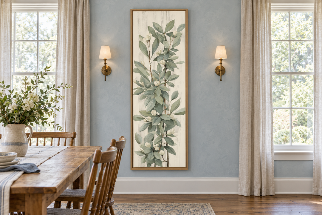 Tall slim vertical vintage sage green leaves framed canvas wall art in a blue dining room.