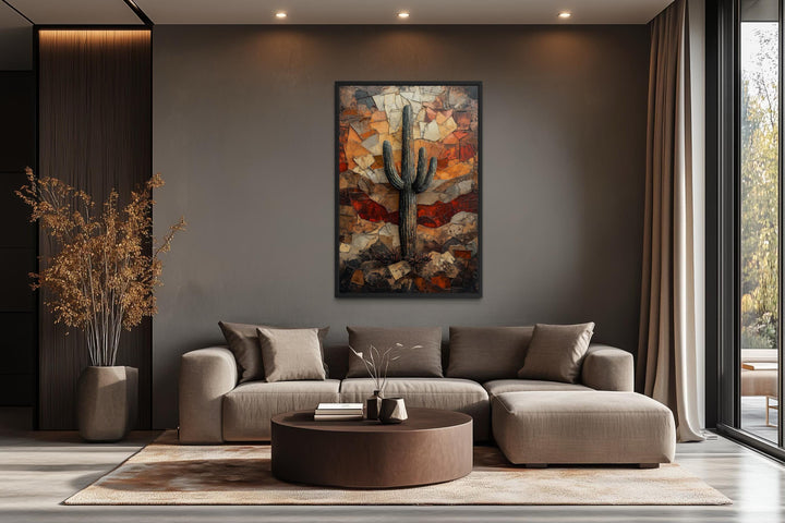 Saguaro Cactus Wall Art canvas print in a rustic desert landscape above a neutral sofa.