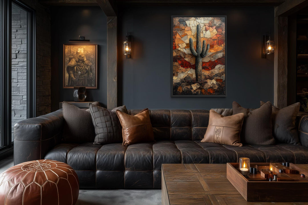 Saguaro Cactus Wall Art canvas print in a rustic living room with dark walls and leather sofa.