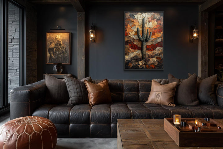 Saguaro Cactus Wall Art canvas print in a rustic living room with dark walls and leather sofa.