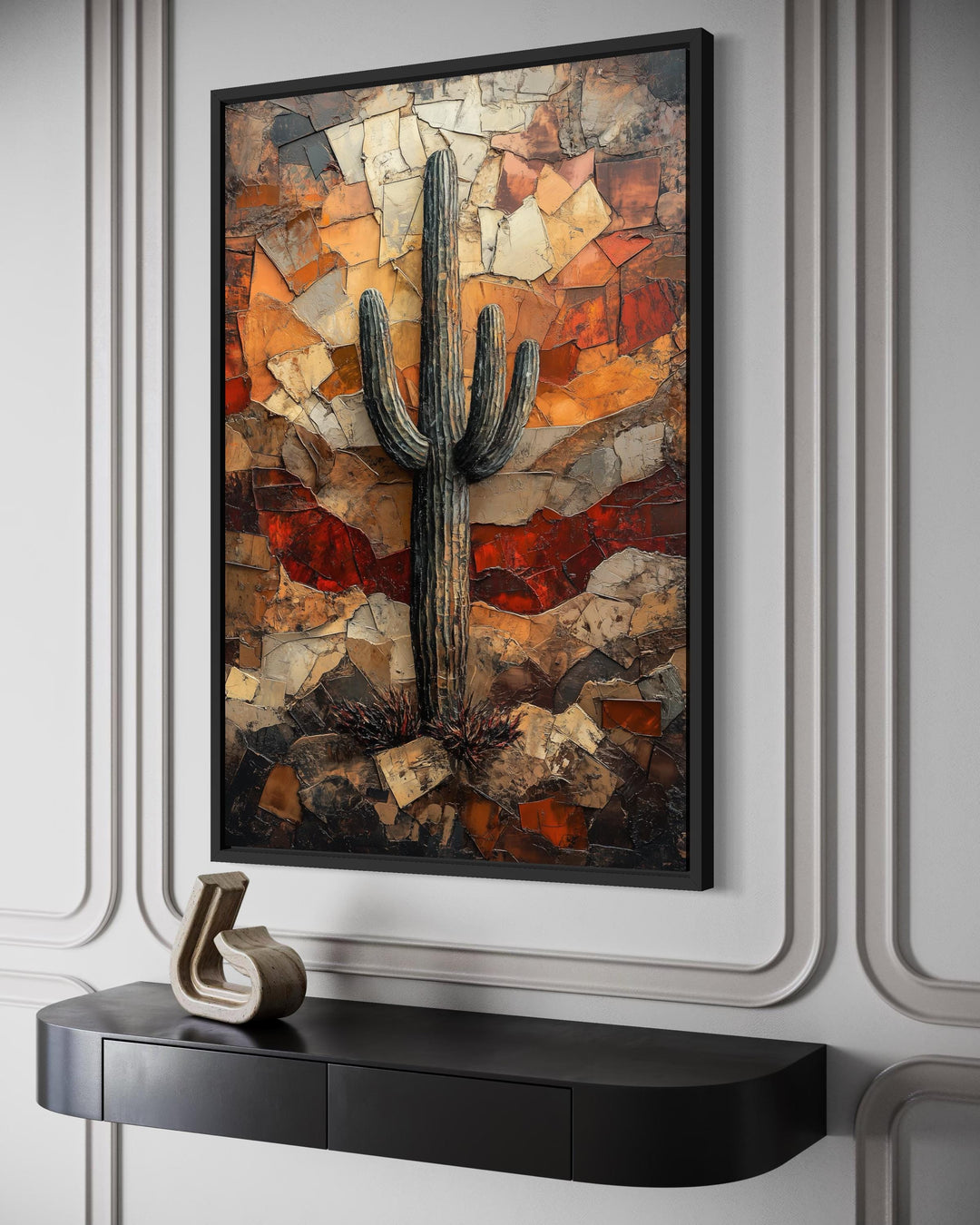 Saguaro cactus wall art in a rustic mosaic style with earthy tones, framed on a neutral wall.