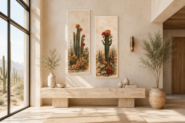 Set of 2 vertical saguaro cactus botanical prints with orange blooms in a desert-style entryway.