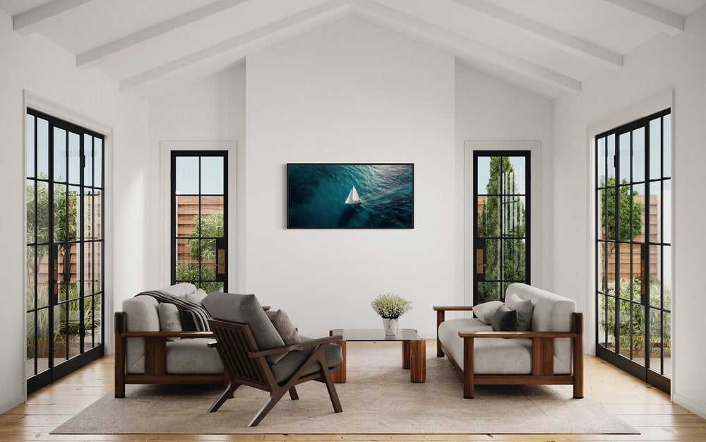 Sailboat In The Ocean Framed Canvas Nautical Wall Art in living room