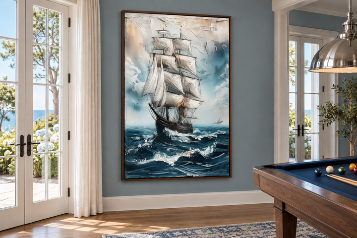 Large abstract painting of a sailing ship on a blue ocean in a walnut frame on a gray wall.