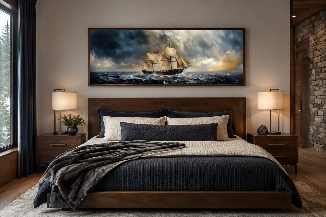 Sailing ship in stormy sea long horizontal canvas wall art hanging above a bed in a bedroom.