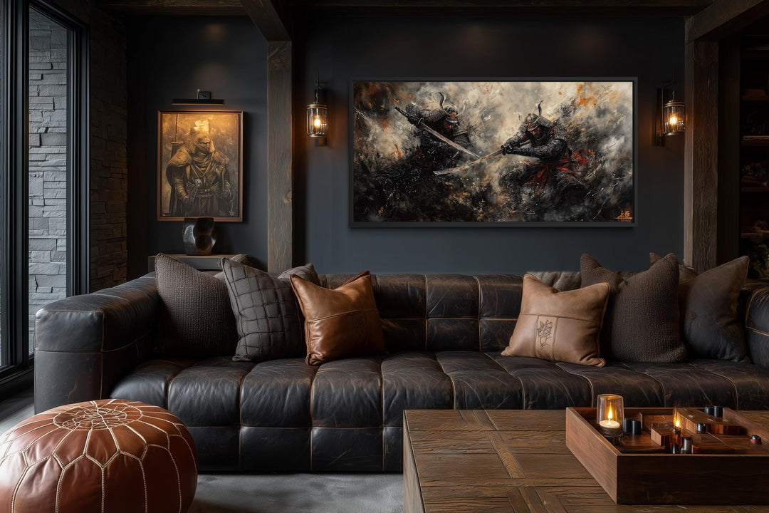 A wide canvas of a dramatic samurai duel in dark tones hangs above a leather sofa in a moody room.