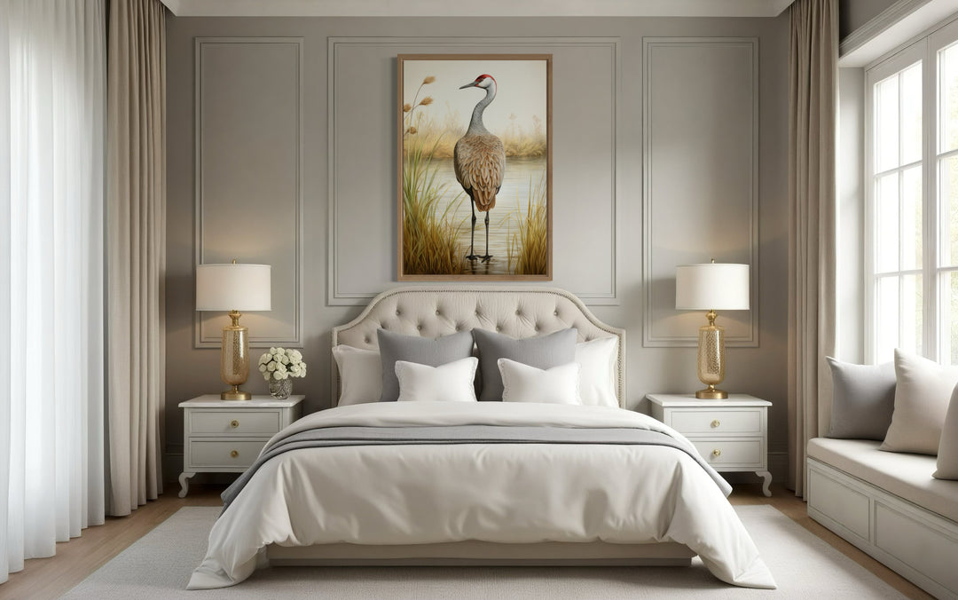 Sandhill Crane Vintage Framed Canvas Wall Art hanging above a bed in a neutral-toned bedroom.