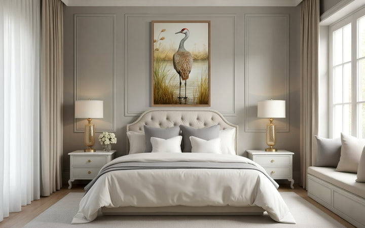 Sandhill Crane Vintage Framed Canvas Wall Art hanging above a bed in a neutral-toned bedroom.