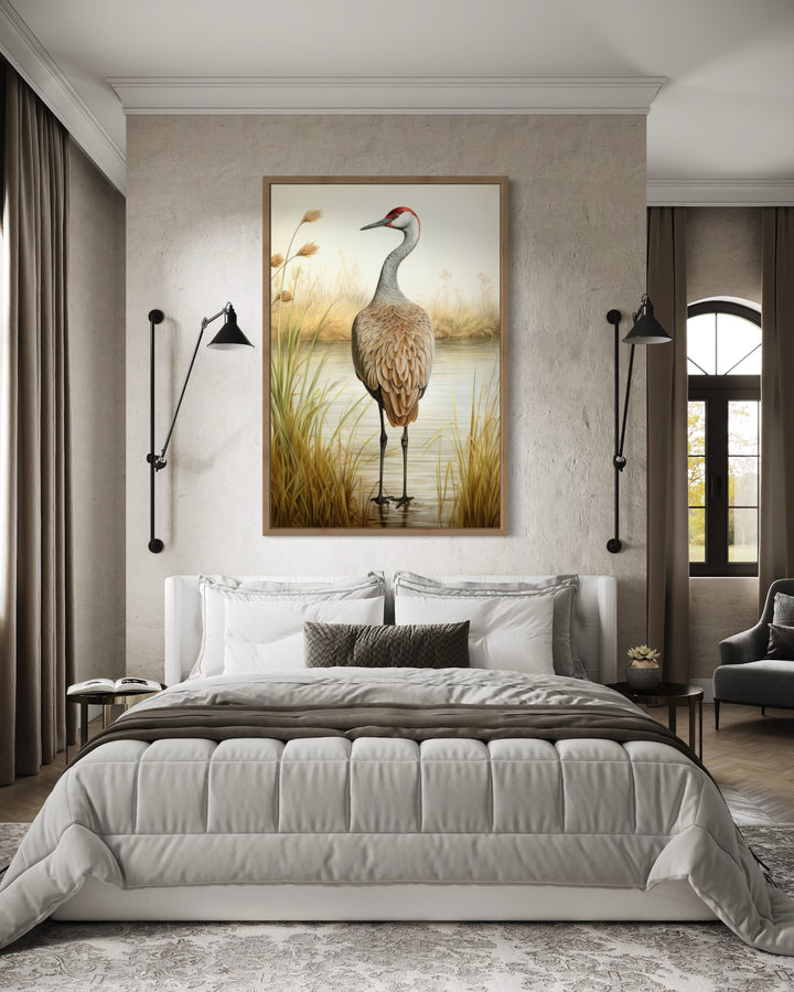 Sandhill Crane Vintage Framed Canvas Wall Art hanging above a bed in a modern bedroom.