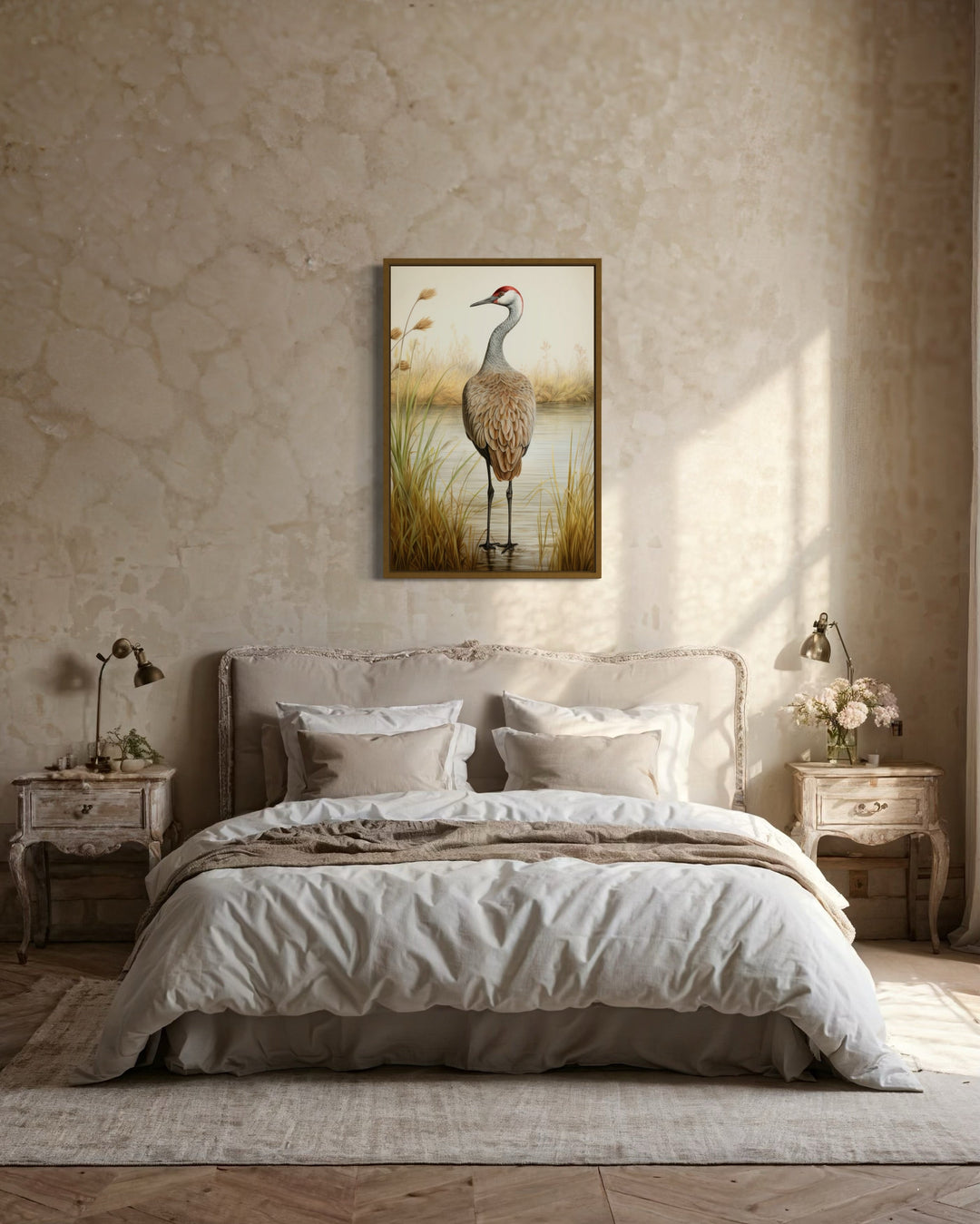 Sandhill Crane Vintage Framed Canvas Wall Art hanging above a bed in a rustic, neutral bedroom.