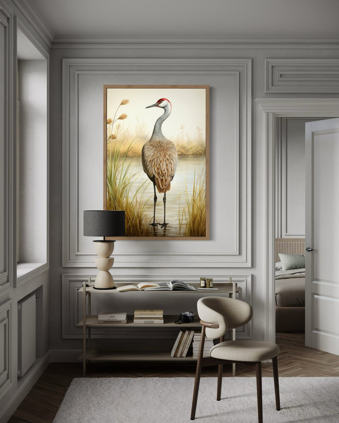 Sandhill Crane Vintage Framed Canvas Wall Art hanging above a console table in a neutral room.