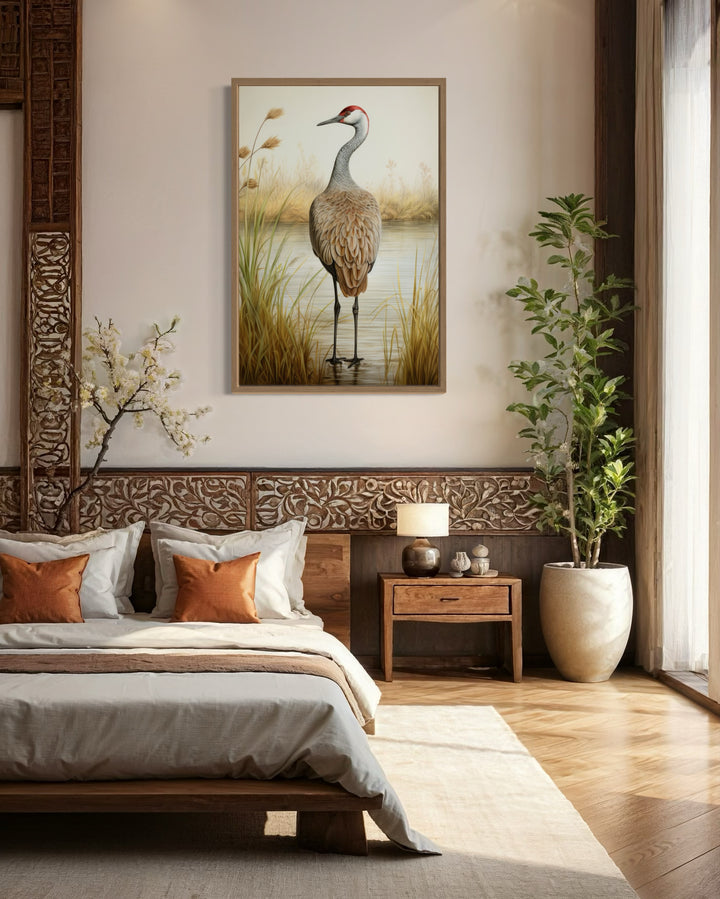 Sandhill Crane Vintage Framed Canvas Wall Art hanging above a bed in a rustic bedroom.
