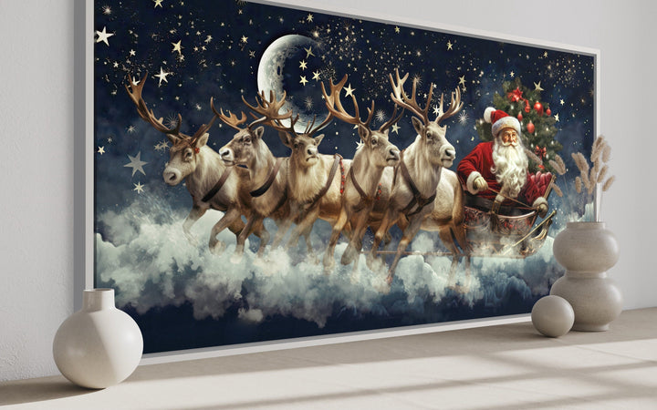 Santa Claus in a sleigh pulled by reindeer flying through a starry night sky canvas wall art.