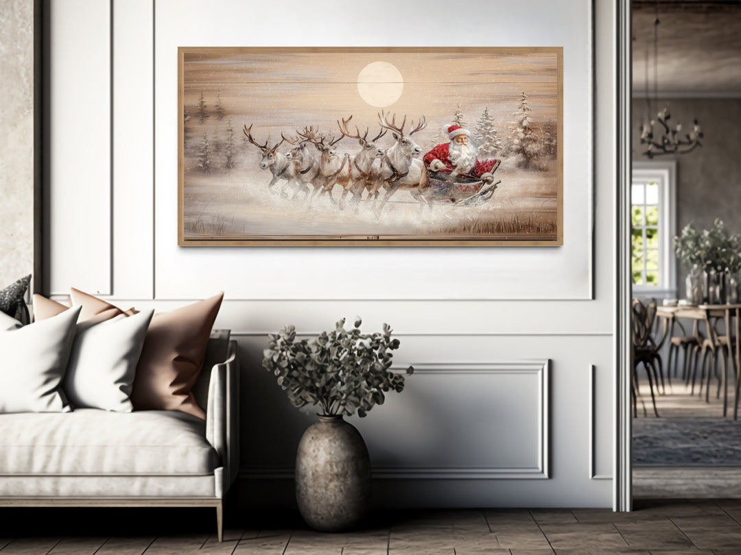 Rustic Santa Claus in sleigh with reindeer canvas wall art in a farmhouse living room.