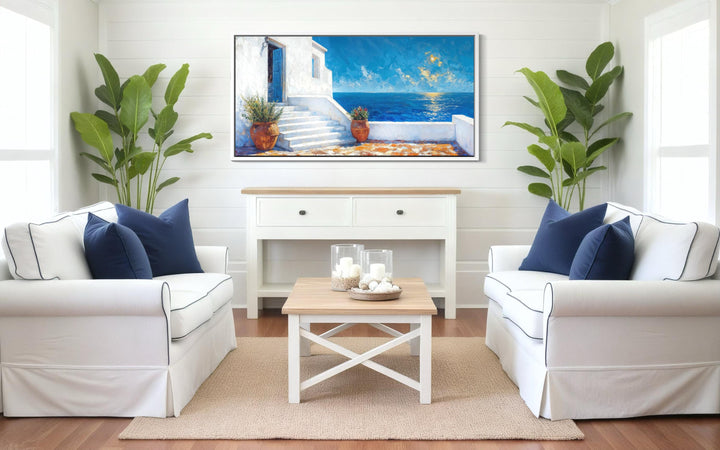 Santorini Greek island coastal ocean view villa Mediterranean wall art in a bright living room.