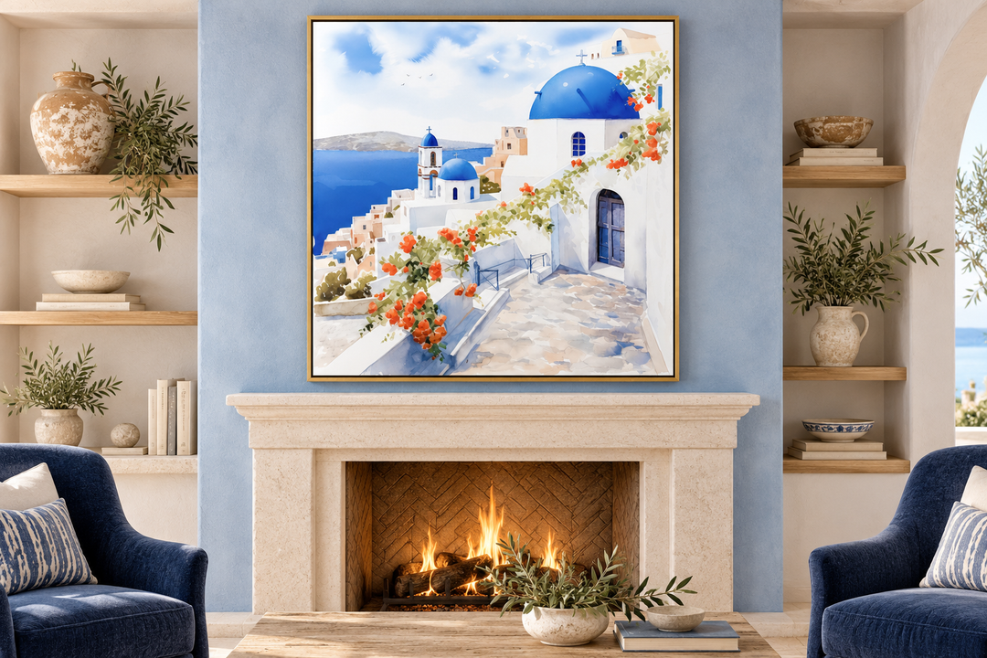 Santorini Greece watercolor framed canvas wall art hanging above a fireplace in a living room.