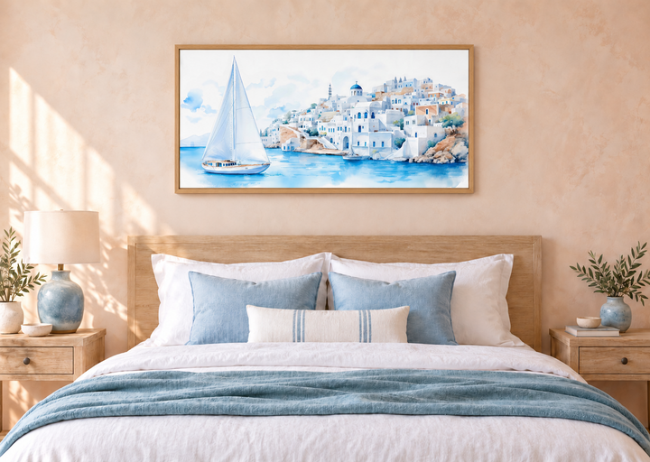 Santorini Sea and Sailboat Framed Canvas Wall Art above a bed in a coastal-style bedroom.