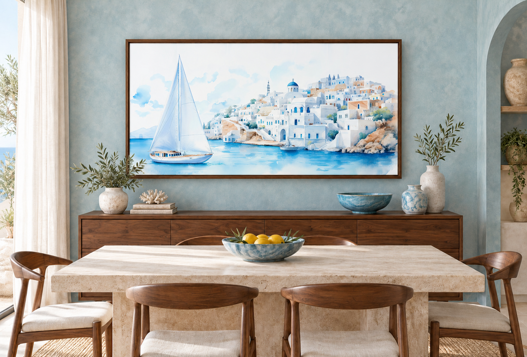 Santorini Sea and Sailboat Framed Canvas Wall Art in a walnut frame above a dining room sideboard.