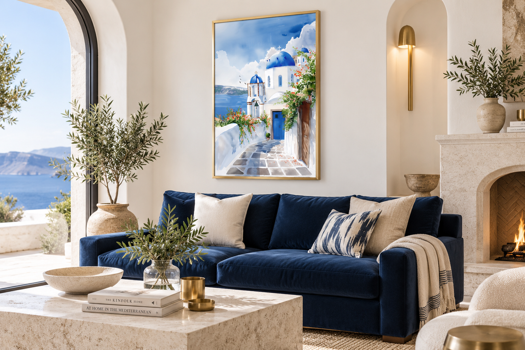 Santorini Greece travel poster with blue domes and white buildings in a gold frame over a blue sofa.