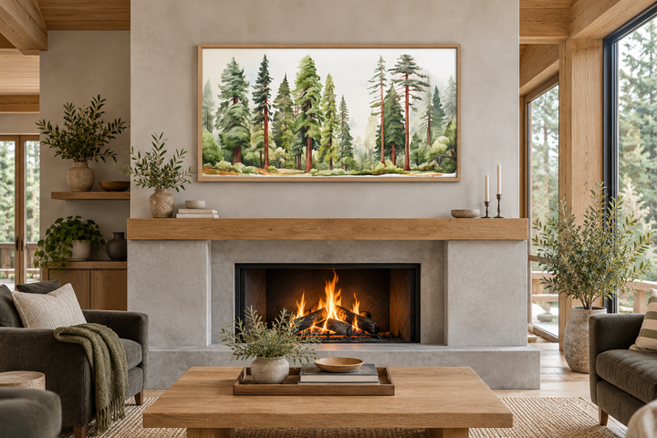 Woodlands forest watercolor framed canvas wall art hanging above a modern fireplace in a cabin.