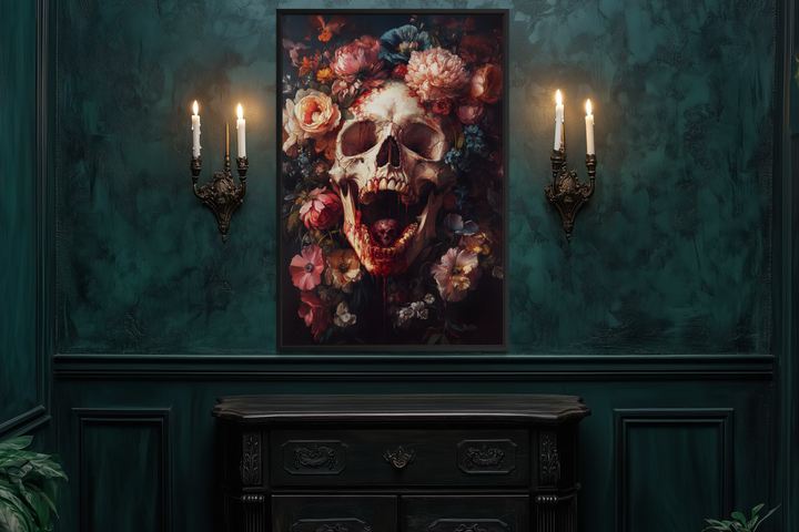 a dark, moody room with a large, ornate painting of a skull surrounded by flowers hanging on the wall. The painting is illuminated by two candles on either side, creating a dramatic and atmospheric effect. In front of the painting, there is a dark wooden dresser or cabinet, adding to the overall dark and mysterious ambiance of the room.