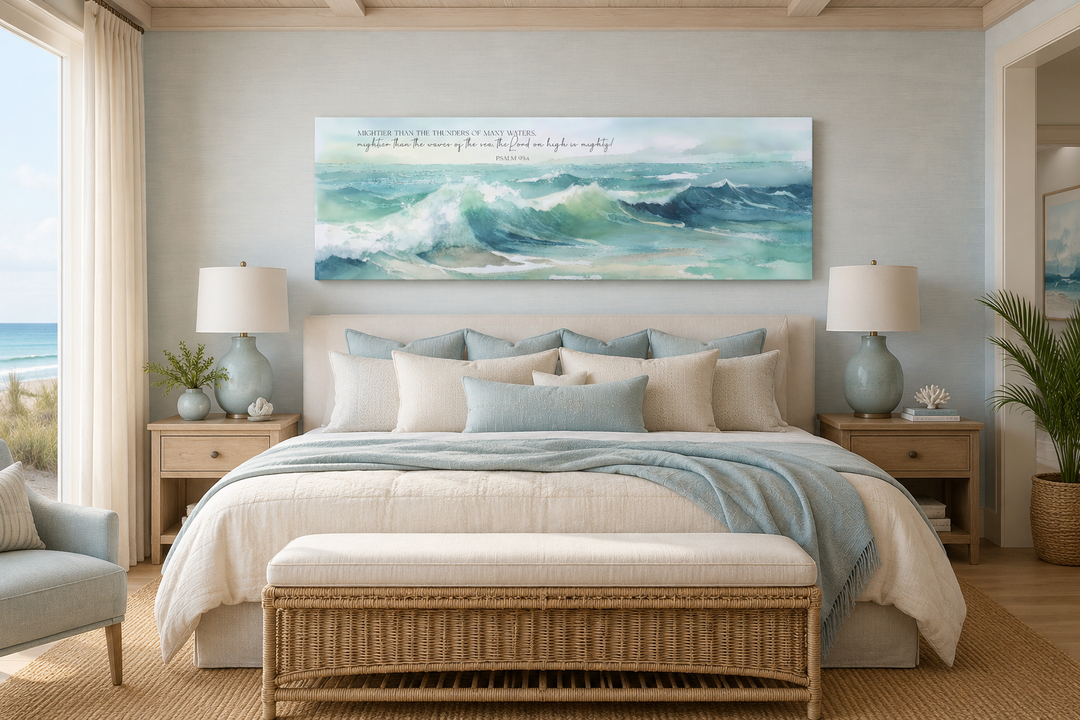 Mightier Than The Waves scripture wall art over a bed in a coastal-style bedroom.