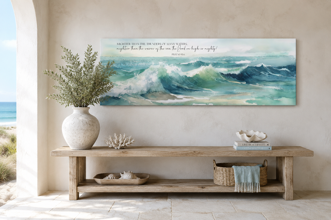 Mightier Than The Waves Psalm 93:4 horizontal framed canvas wall art above a wooden console table.