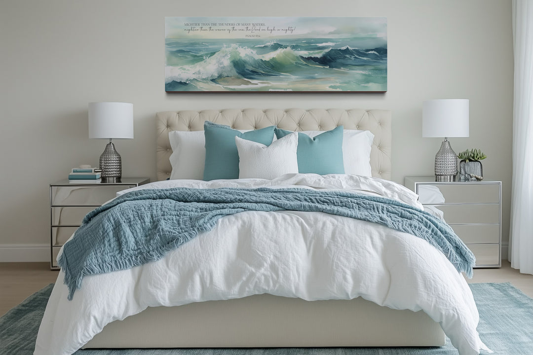 Mightier Than The Waves horizontal framed canvas wall art with Psalm 93:4 over a bed.