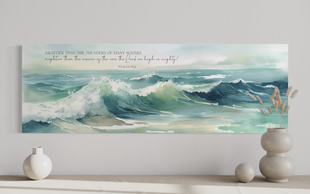 Horizontal framed canvas wall art featuring ocean waves and Psalm 93:4 scripture in a modern room.