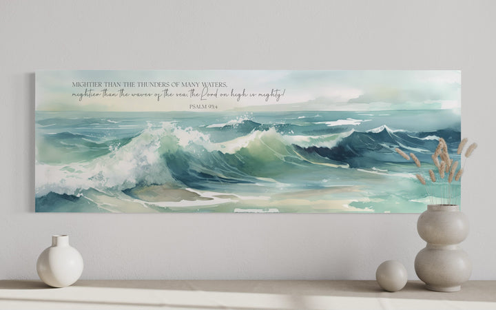 Horizontal framed canvas wall art featuring ocean waves and Psalm 93:4 scripture in a modern room.