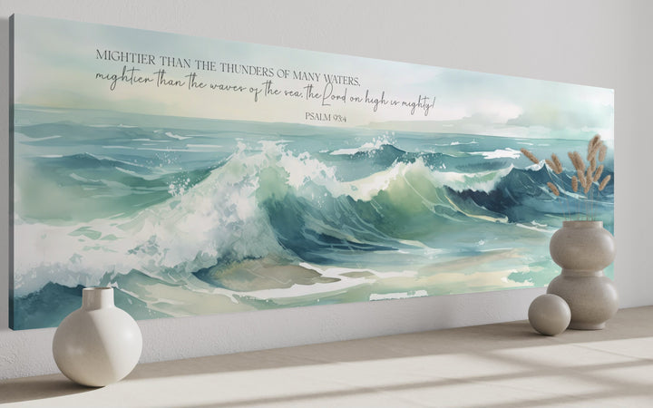 Horizontal framed canvas wall art featuring ocean waves and Psalm 93:4 scripture in a modern room.