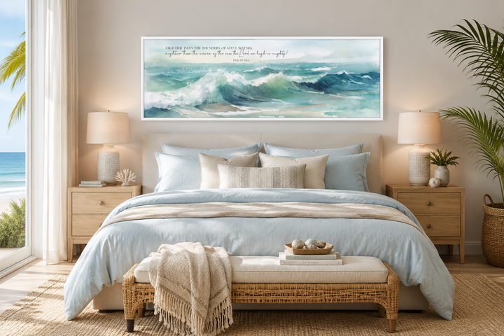 Horizontal framed canvas wall art of ocean waves with Psalm 93:4 scripture over a bed.