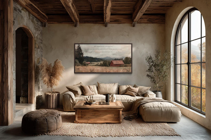 Scripture wall art of Numbers 6:24-26 over a peaceful landscape with a red barn in a rustic room.